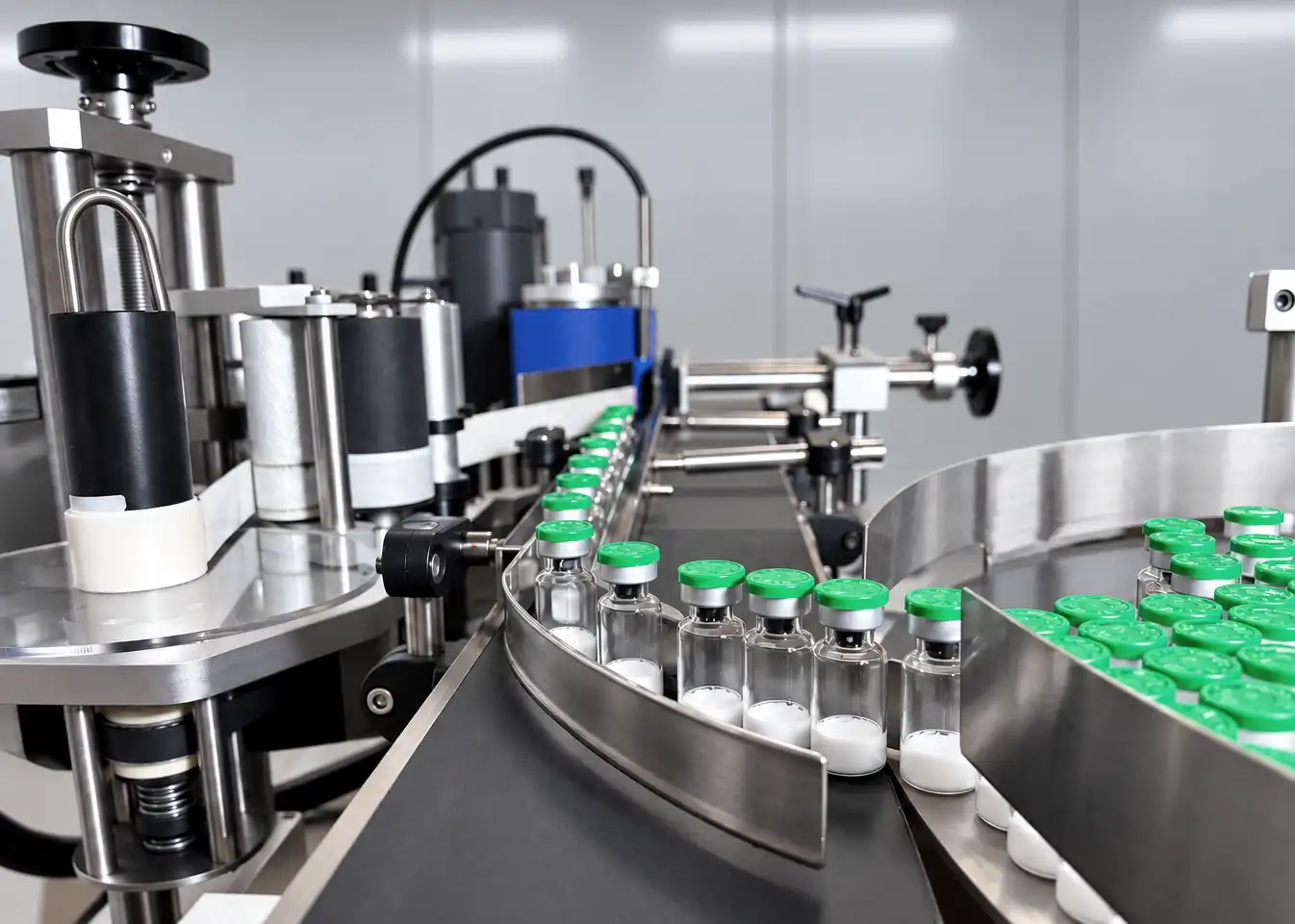 Labeling machine turntable applying batch-numbered vial labels.